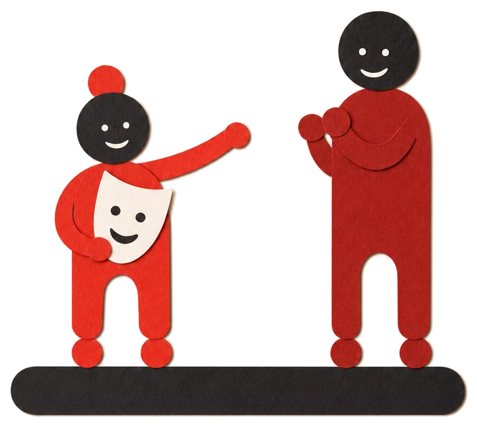 Illustration: Ein Kind probiert auf einem kleinen Podest eine Rolle mit Maske aus, die Spielleitung klatscht.